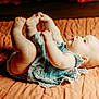 Stella joined the competition — help win amazing prizes! baby, infant, child, blue_dress, blanket, orange_blanket, skin, feet, toes, lying_down, cute, curious, indoors, soft_light, portrait, person, young_child, playful, chubby, closeup