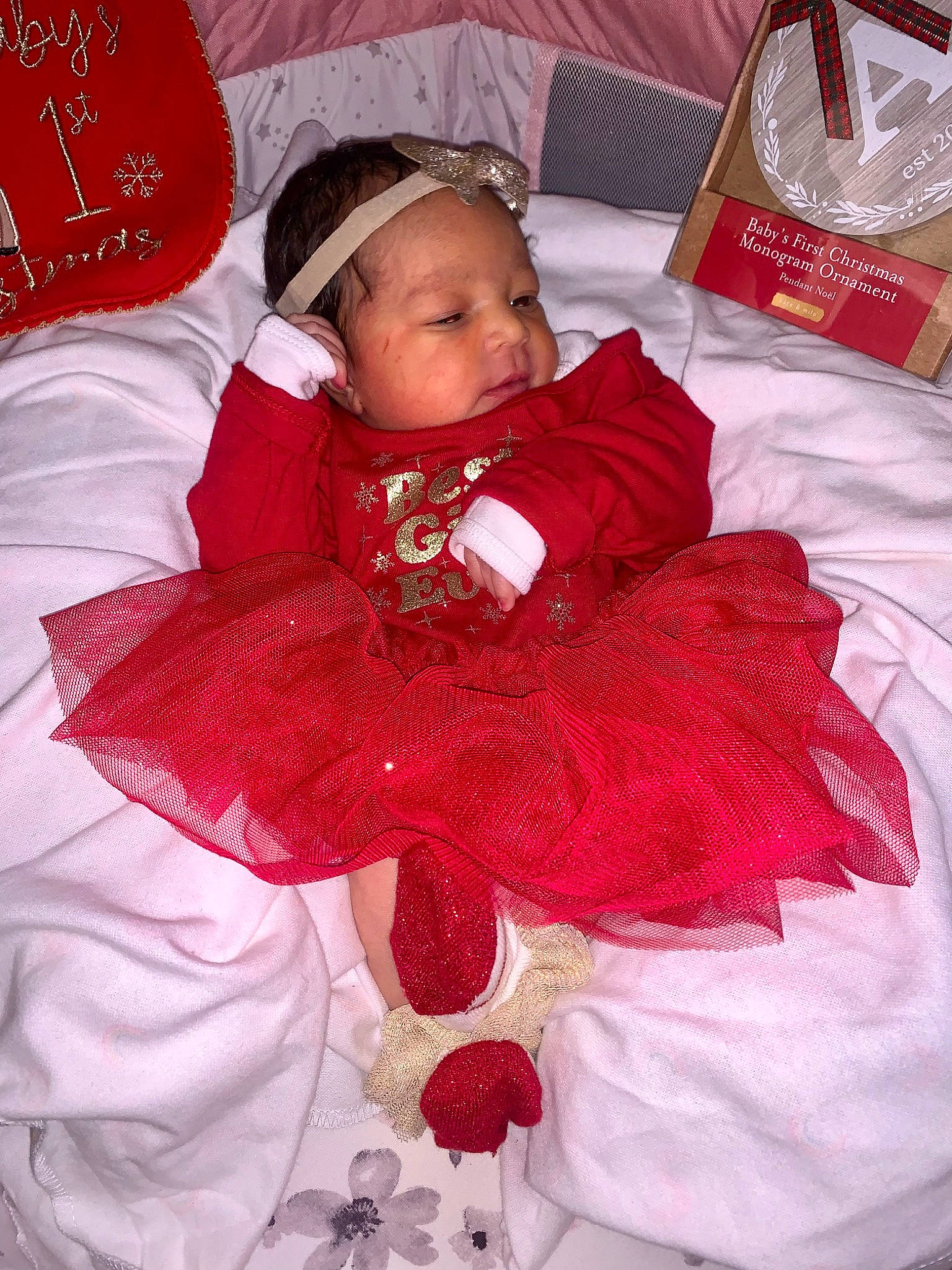 Akeira is registered to the contest to win money with this photo: baby, baby_toddler_clothing, bag, cap, carmine, cheek, child, comfort, embellishment, event, happy, linens, magenta, pattern, person, petal, pink, room, sleeve, textile