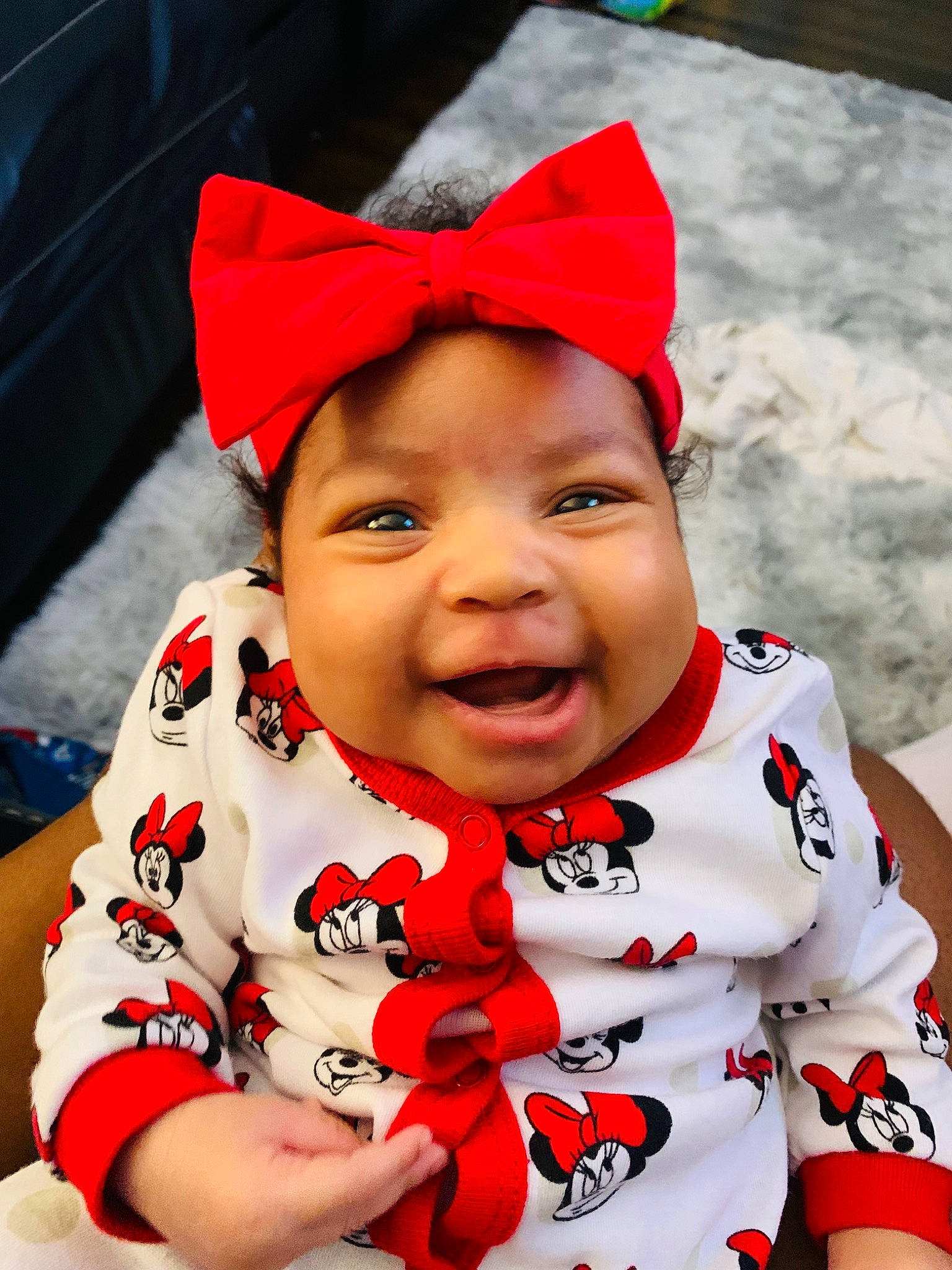 Akeira is registered to the contest to win money with this photo: baby, cap, cheek, chin, close_up, eye, eyebrow, fun, happy, head, headwear, lip, mouth, nose, person, pink, red, skin, sleeve, smile