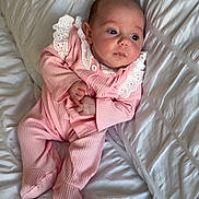 Malina joined the competition — help win amazing prizes! infant, baby, pink_clothing, white_bedspread, lace, cozy, portrait, child, sleepwear, soft_texture, cute, newborn, lying_down, bed, resting, small_hands, curious, indoors, peaceful, comfort