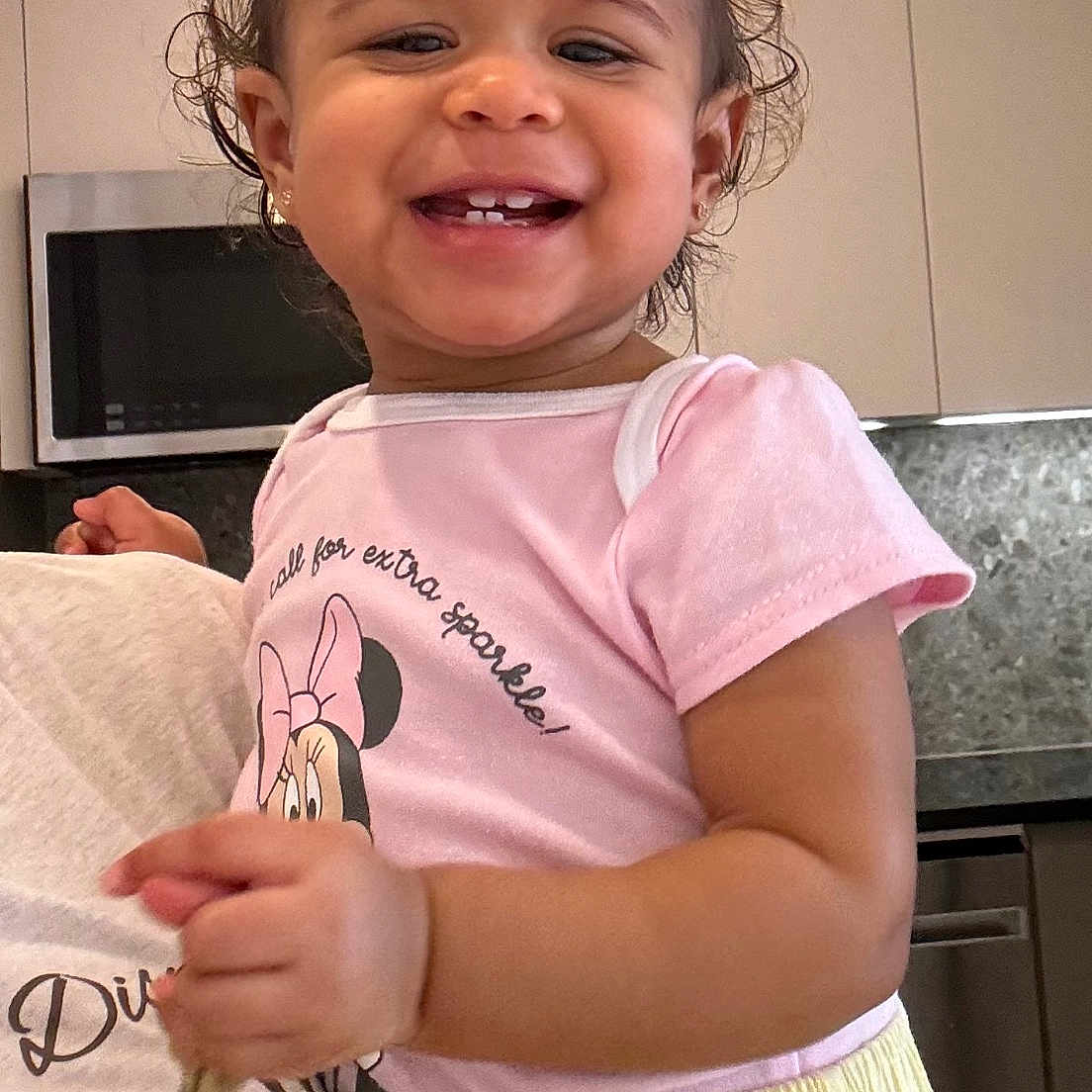 Ashlany joined the competition — help win amazing prizes! appliance, baby, cabinet, child, cute, face, hair, happy, holding, indoor, kitchen, lighting, minnie_mouse, person, pink_shirt, portrait, short_sleeves, smiling, toddler, yellow_pants