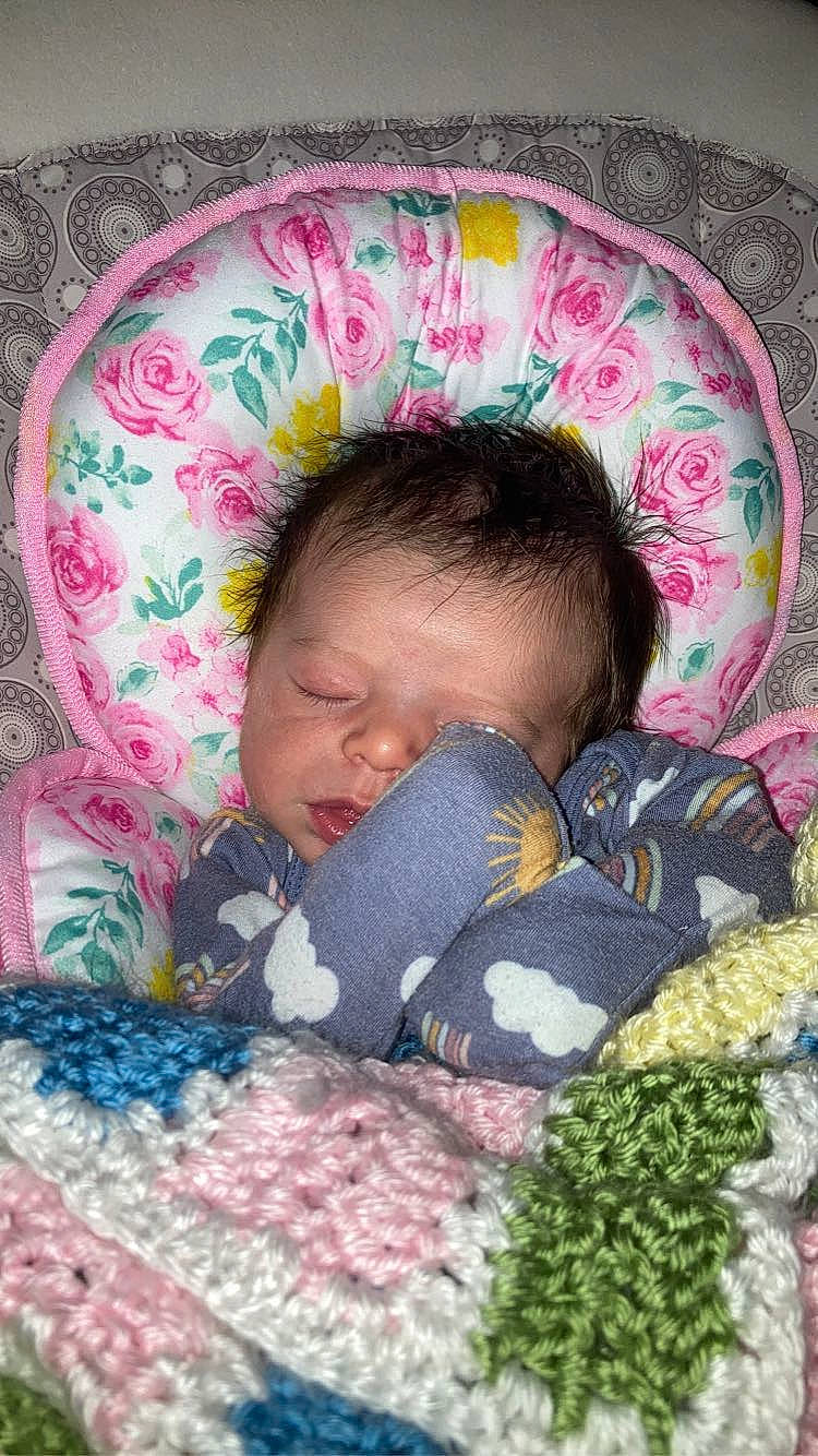 Alejandra is registered to the contest to win money with this photo: baby, baby_products, baby_sleeping, baby_toddler_clothing, bed, bedding, bedtime, cheek, child, comfort, linens, magenta, mammal, pattern, person, pink, product, skin, sleeve, textile
