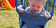 Reggie joined the competition — help win amazing prizes! baby, child, swing, playground, grass, outdoor, smile, happy, blue, rope, sunny, daylight, park, legs, clothing, footwear, play, fun, nature, person