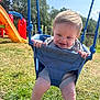 baby, child, swing, playground, grass, outdoor, smile, happy, blue, rope, sunny, daylight, park, legs, clothing, footwear, play, fun, nature, person