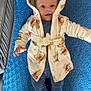 Reggie joined the competition — help win amazing prizes! baby, child, hooded_robe, teddy_bear_print, blue_blanket, smile, face, eyes, hand, footwear, pajamas, indoor, soft_texture, cute, lying_down, comfort, warm_clothing, infant, person, portrait