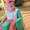 Lilith joined the competition — help win amazing prizes! baby, infant, child, pink_bow, headband, smiling, happy, teal_seat, baby_seat, white_top, cherry_print, pink_pants, indoor, floor, carpet, cute, portrait, sitting, young_child, human