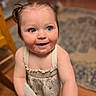 toddler, child, baby, blue_eyes, smiling, indoor, curly_hair, cloth, playful, cute, skin, dress, person, portrait, happy, standing, wooden_floor, carpet, home, young