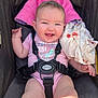 baby, smiling, stroller, pink_onesie, unicorn, blanket, harness, happy, child, infant, cute, blue_eyes, skin, clothing, seat, sunlight, portrait, baby_girl, baby_boy, outdoor