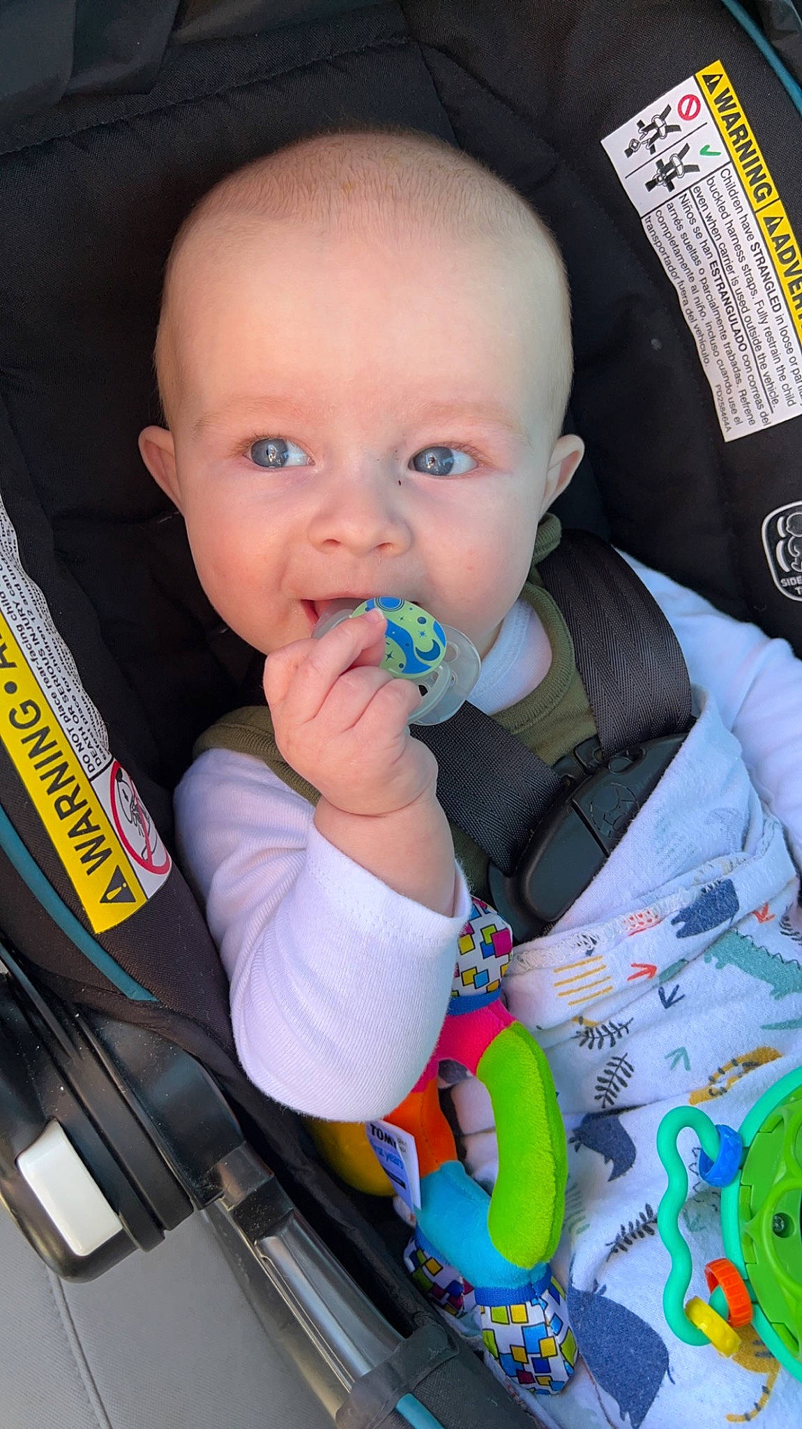 Easton is registered to the contest to win money with this photo: baby, baby_carriage, baby_products, baby_safety, baby_toddler_clothing, baby_toys, biting, car_seat, cheek, child, ear, fun, iris, nail, nose, person, product, sitting, skin, thumb