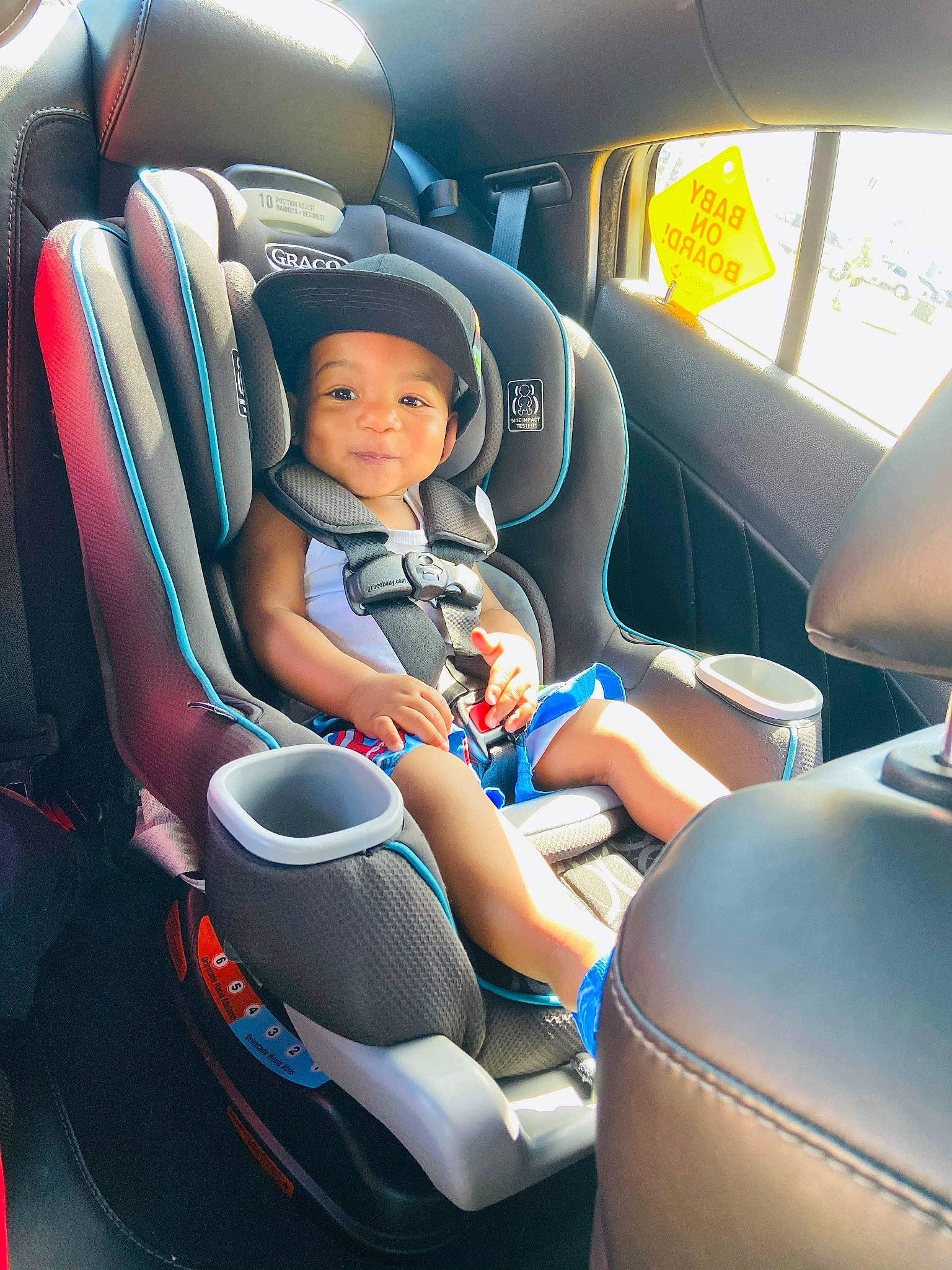 Jewel is registered to the contest to win money with this photo: airline, auto_part, baby_in_car_seat, car, car_seat, car_seat_cover, child, family_car, head_restraint, headwear, passenger, person, vehicle