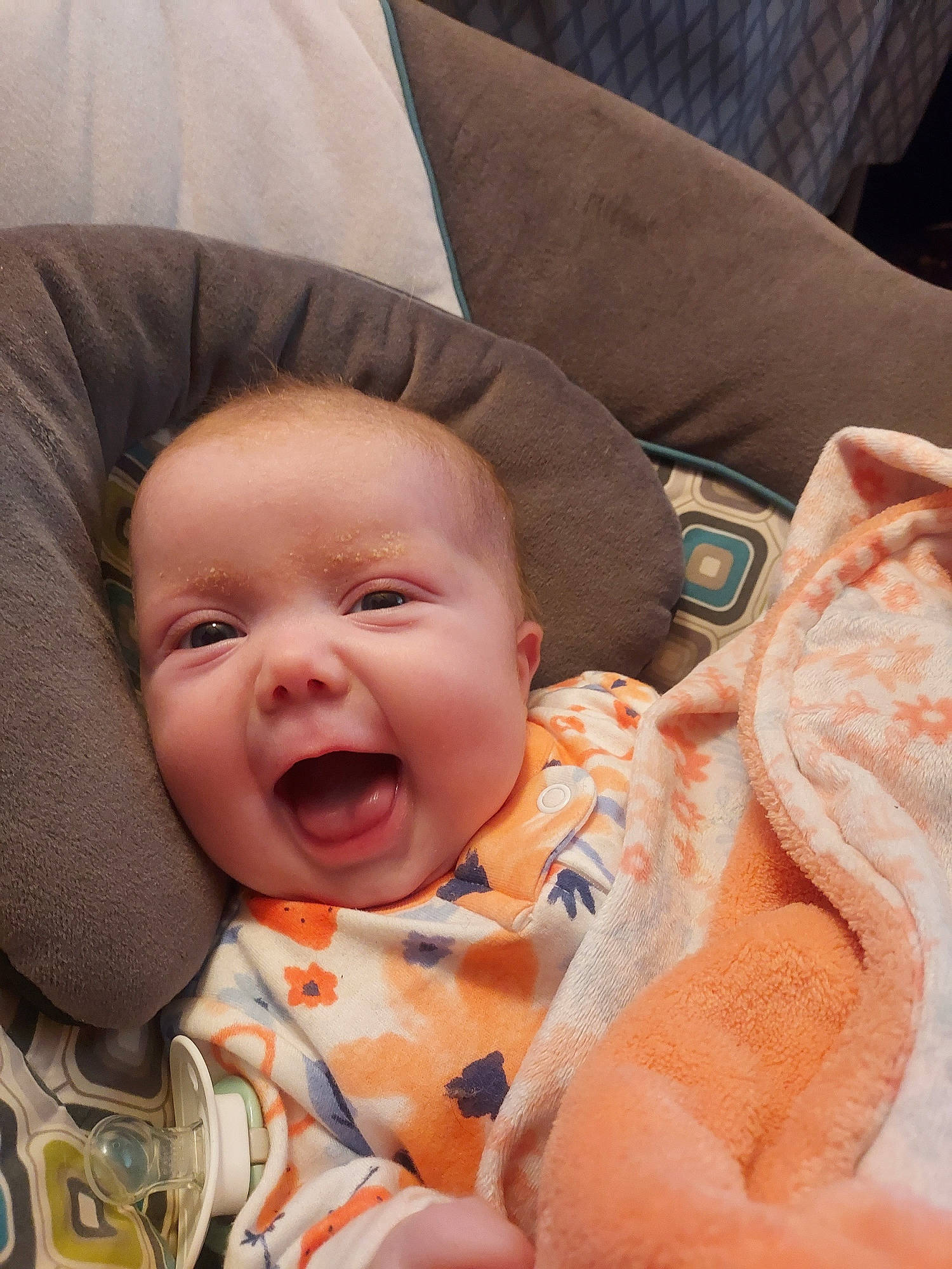 Ahrayla is registered to the contest to win money with this photo: baby, baby_toddler_clothing, cheek, child, chin, comfort, eye, face, finger, happy, head, iris, linens, mouth, nose, person, pink, skin, smile, textile