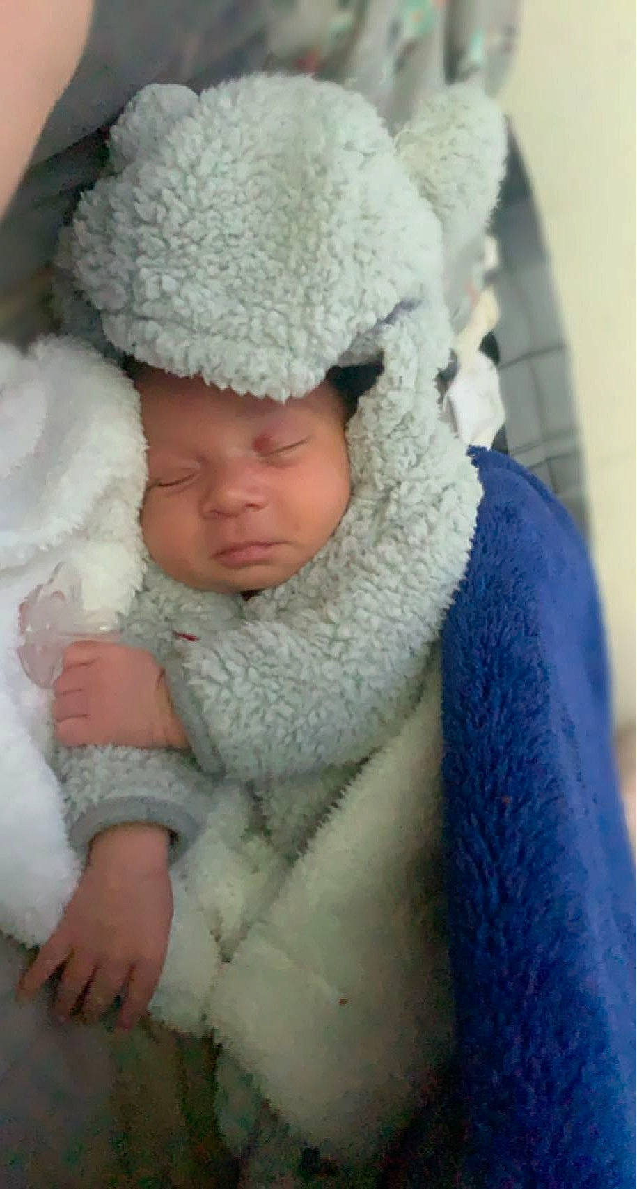 Diallo joined the competition — help win amazing prizes! baby, baby_sleeping, beanie, cap, comfort, electric_blue, eye, fashion_accessory, freezing, fur, fur_clothing, headwear, knit_cap, linens, outerwear, person, skin, textile, toddler, tree