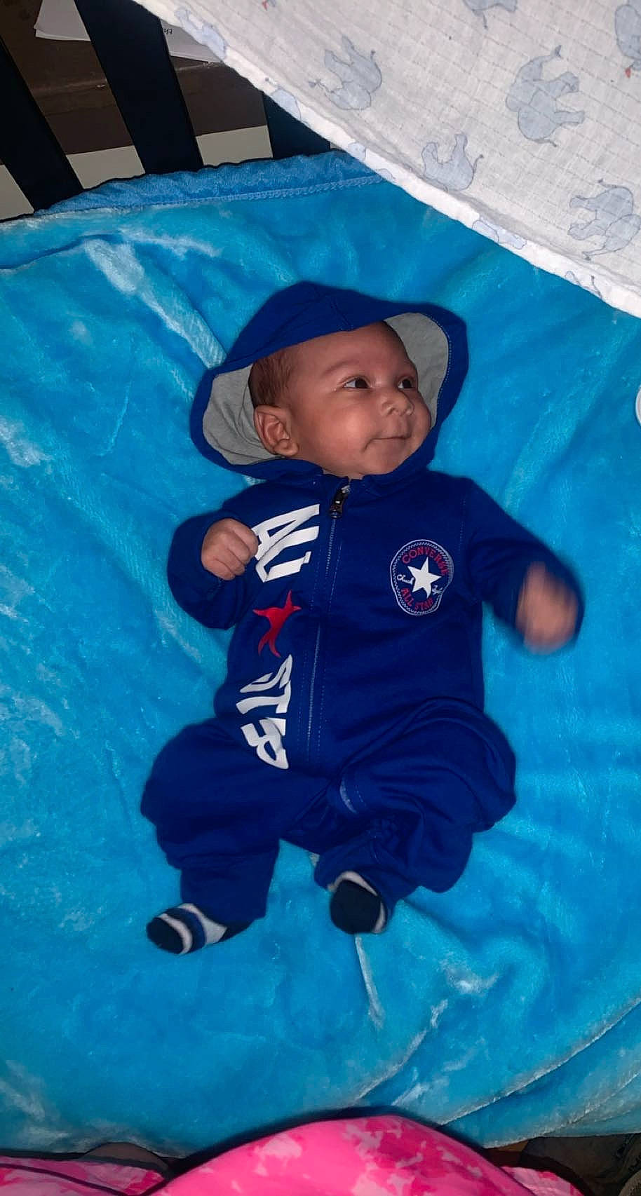 Diallo is registered to the contest to win money with this photo: aqua, azure, baby, baby_toddler_clothing, child, electric_blue, fun, happy, hat, headwear, leisure, linens, person, pink, play, product, recreation, t_shirt, textile, toddler