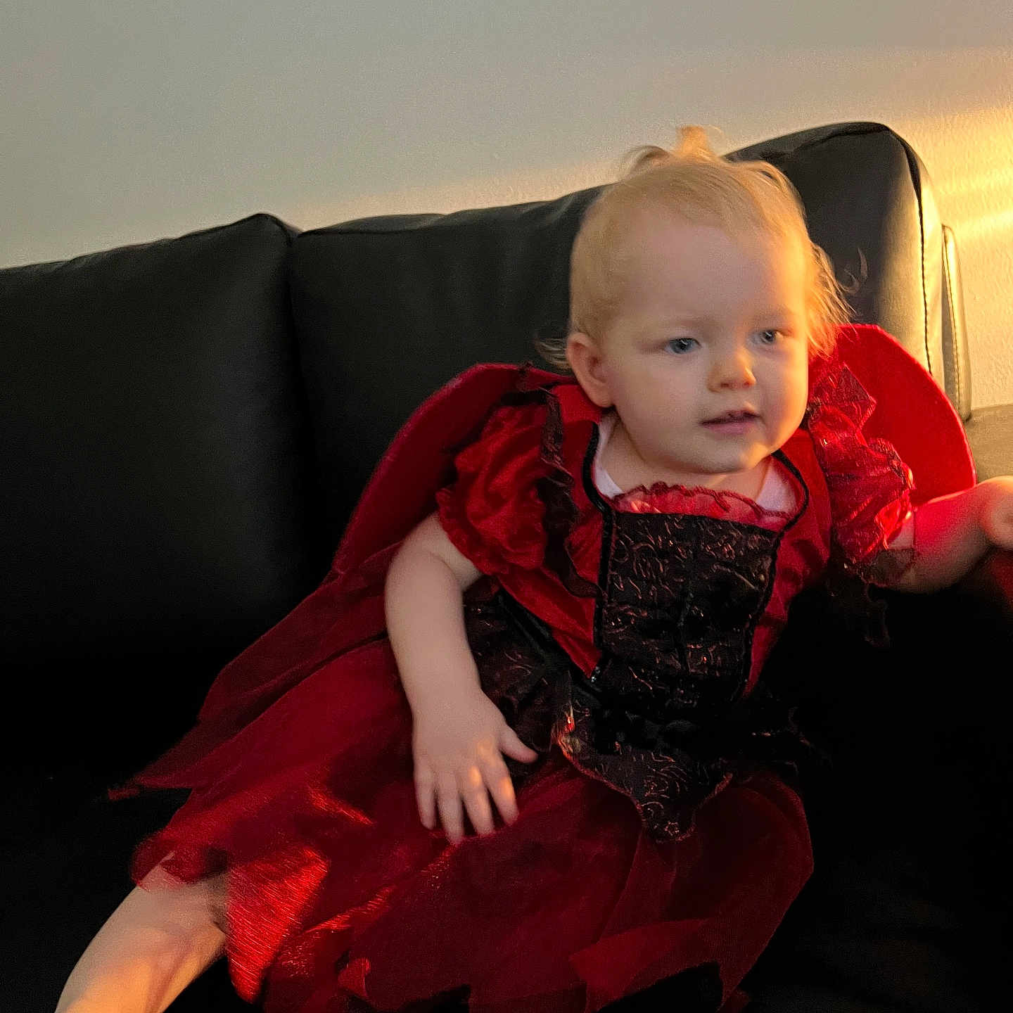 Ruby is registered to the contest to win money with this photo: architecture, baby, barefoot, blanket, blonde, bodypart, building, cape, chair, clothing, coat, costume, couch, cushion, dress, eveningdress, face, fashion, finger, formalwear