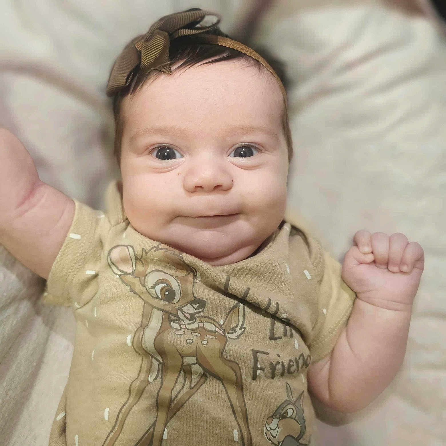 Paislee joined the competition — help win amazing prizes! baby, infant, child, headband, onesie, cartoon, deer, smile, face, hand, cute, indoors, soft, blanket, expression, portrait, chubby_cheeks, young, closeup, happy