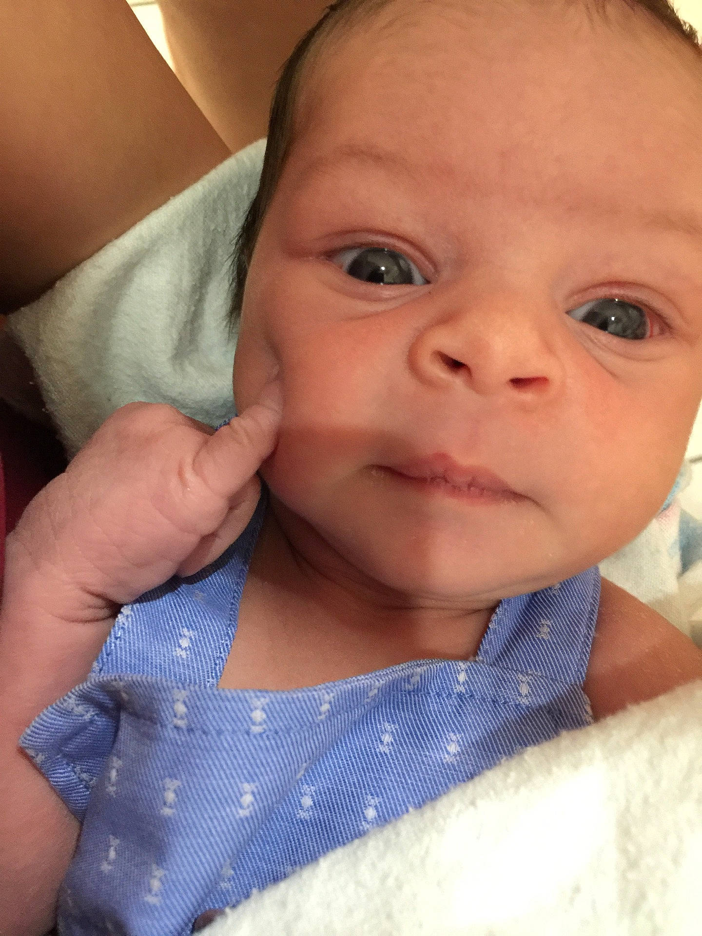 Ivory is registered to the contest to win money with this photo: blue, cheek, child, chin, close_up, ear, eye, face, finger, girl, hand, head, infant, iris, lip, mouth, nose, person, skin, smile