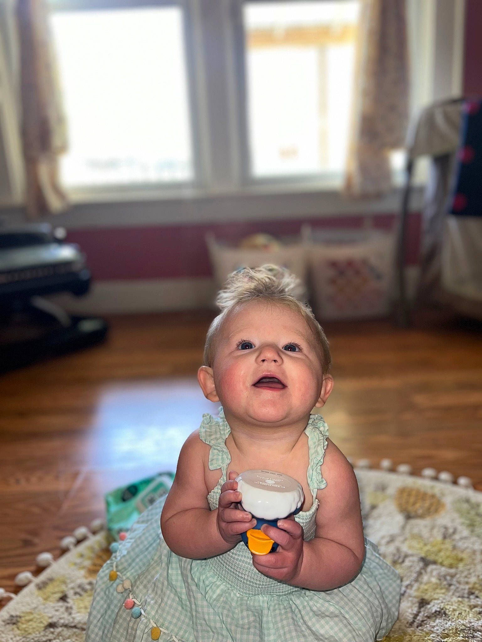 Sadie Mae is registered to the contest to win money with this photo: baby, baby_toddler_clothing, child, curtain, dress, event, floor, flooring, fun, grass, happy, hardwood, leisure, person, room, sitting, skin, toddler, toy, window
