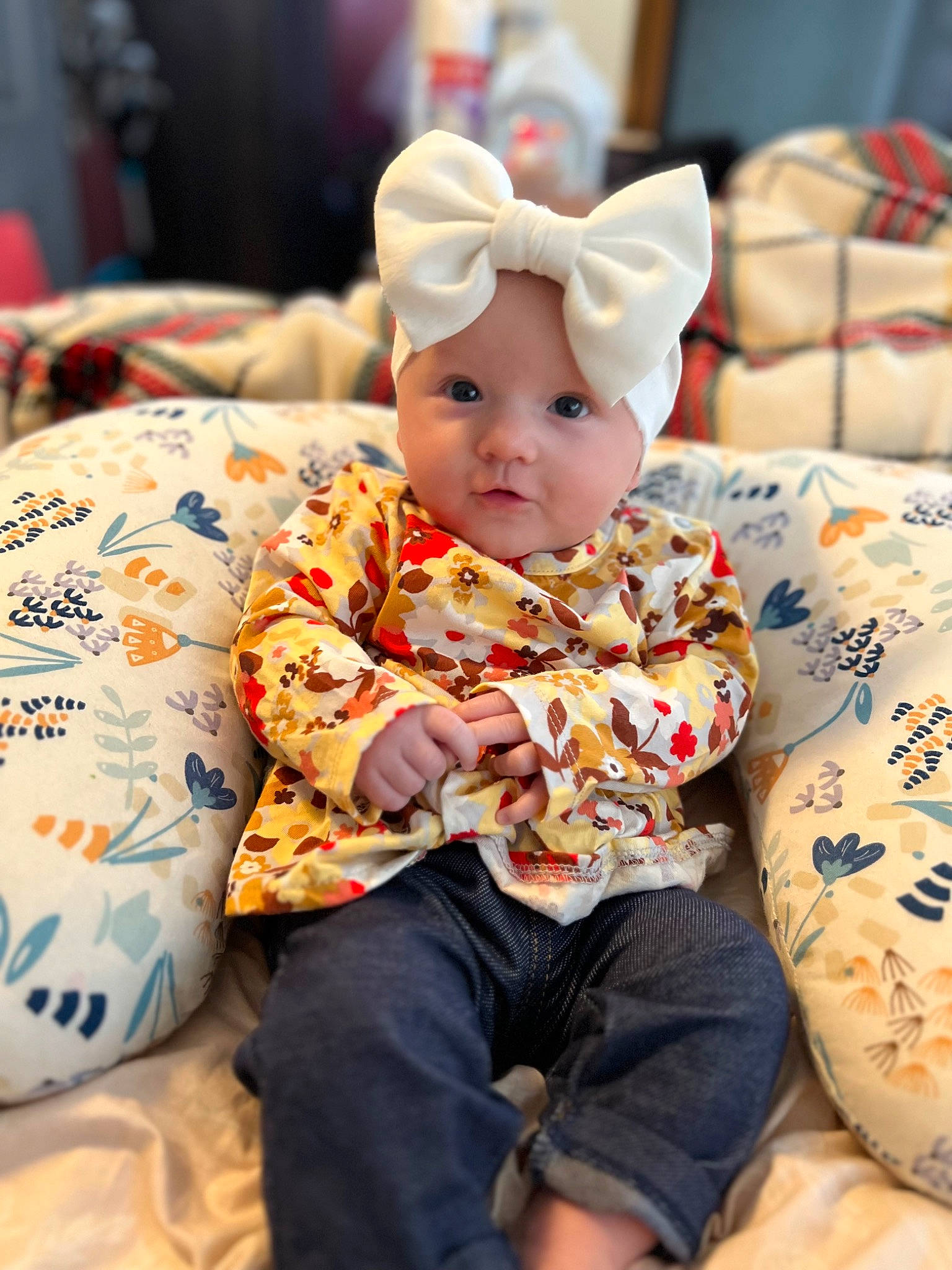 Sadie is registered to the contest to win money with this photo: baby, baby_toddler_clothing, child, christmas, christmas_eve, comfort, event, eye, fun, happy, hat, head, headwear, holiday, human_body, leisure, pattern, person, room, sitting