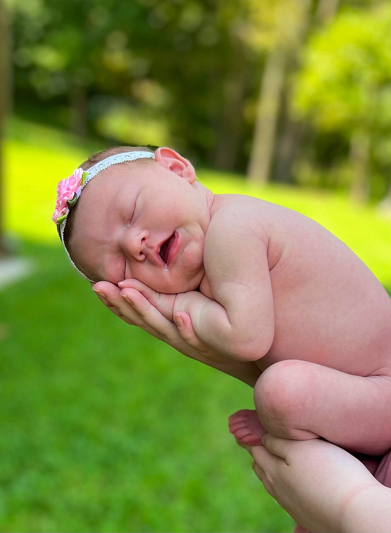 Sadie is registered to the contest to win money with this photo: baby, baby_toddler_clothing, child, finger, gesture, grass, grassland, hand, happy, leisure, nail, people_in_nature, person, plant, portrait_photography, rose_family, thumb, toddler, tree, wrist