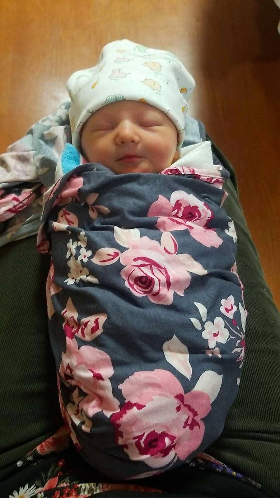 Sadie is registered to the contest to win money with this photo: baby, baby_products, baby_sleeping, baby_toddler_clothing, camouflage, cheek, child, collar, comfort, happy, headwear, hood, linens, outerwear, pattern, peach, person, pink, rose, skin