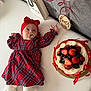 baby, infant, red_dress, headband, pacifier, bed, cake, fruit, strawberries, blueberries, blackberries, raspberries, ribbons, gift_bag, pandora, celebration, four_months, plaid, white_bed, cute