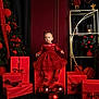 Lya participe au concours pour gagner de l'argent avec cette photo : bows, celebration, child, christmas_ornaments, christmas_tree, decorations, festive, gift_boxes, girl, holiday, holiday_decor, holiday_lights, indoor, pensive, portrait, red, red_dress, shoes, socks, young_child