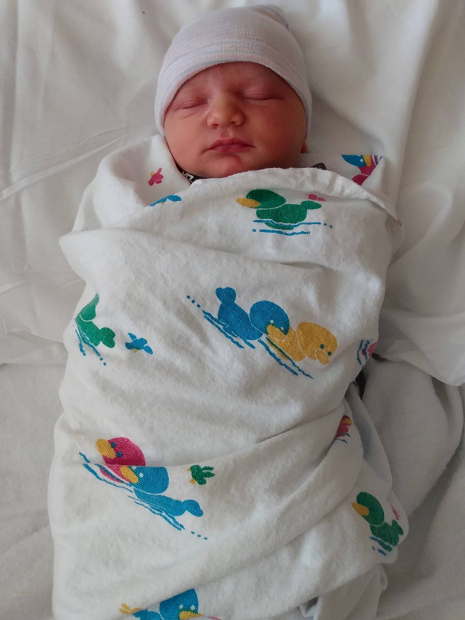 Maddox joined the competition — help win amazing prizes! baby, baby_products, baby_sleeping, baby_toddler_clothing, cap, child, collar, comfort, hat, headwear, linens, pattern, person, product, sleeve, t_shirt, toddler, top, white