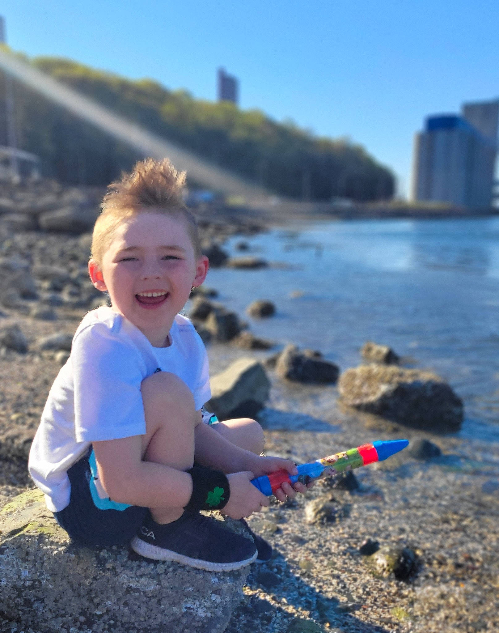 Mayson joined the competition — help win amazing prizes! azure, beach, coastal_and_oceanic_landforms, electric_blue, fun, happy, horizon, joy, lake, leg, leisure, people_in_nature, person, shore, sky, smile, summer, sunlight, toddler, travel