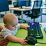 baby, infant, child, computer, keyboard, mouse, desk, office, monitor, rgb_keyboard, green_table, hands, curiosity, desk_chair, technology, playful, adult_hand, portrait, bald_head, indoor