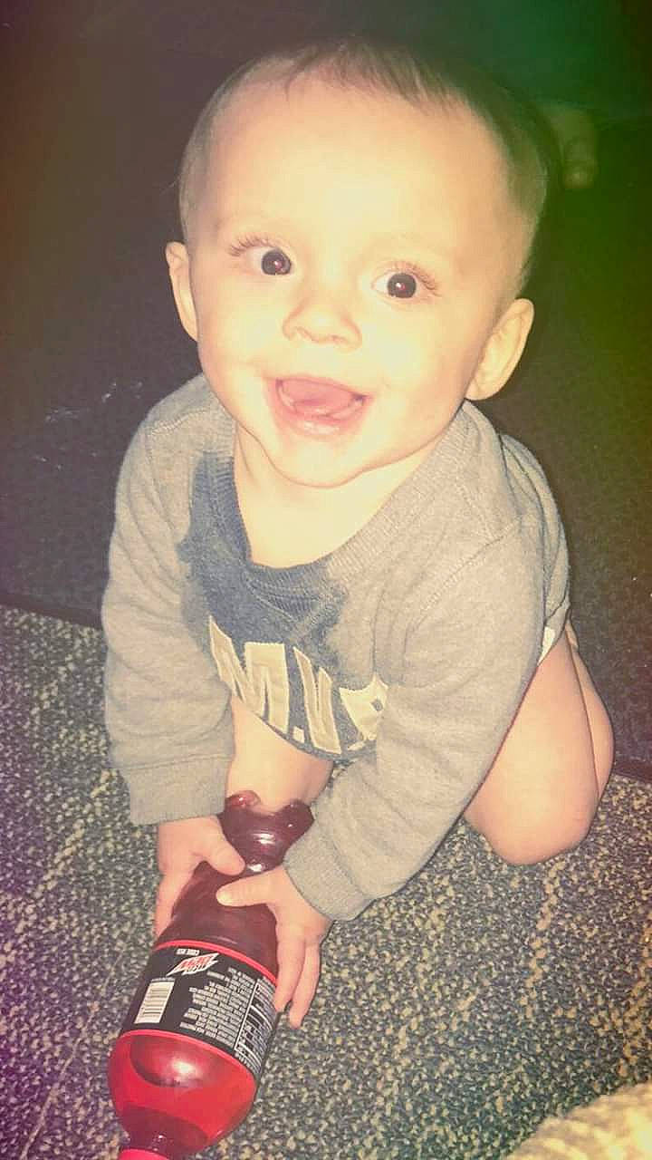 Enrique is registered to the contest to win money with this photo: baby, cheek, child, chin, cool, eye, face, facial_expression, forehead, fun, head, lip, mouth, nose, person, sitting, skin, smile, standing, toddler