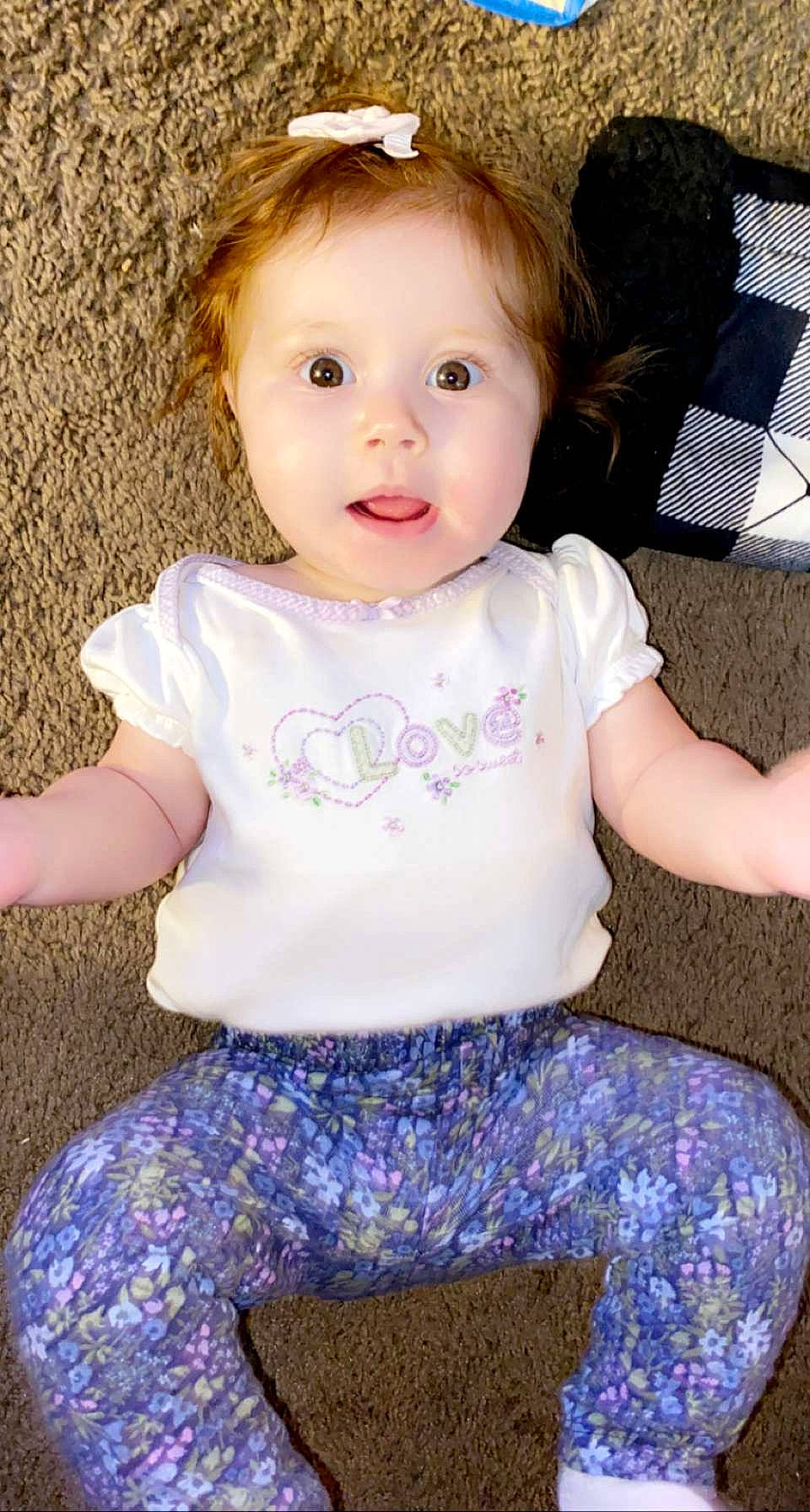 Ivanna joined the competition — help win amazing prizes! baby_toddler_clothing, cheek, child, eyelash, face, facial_expression, hair, happy, head, iris, lip, nose, organ, person, photograph, pink, skin, sleeve, standing, t_shirt