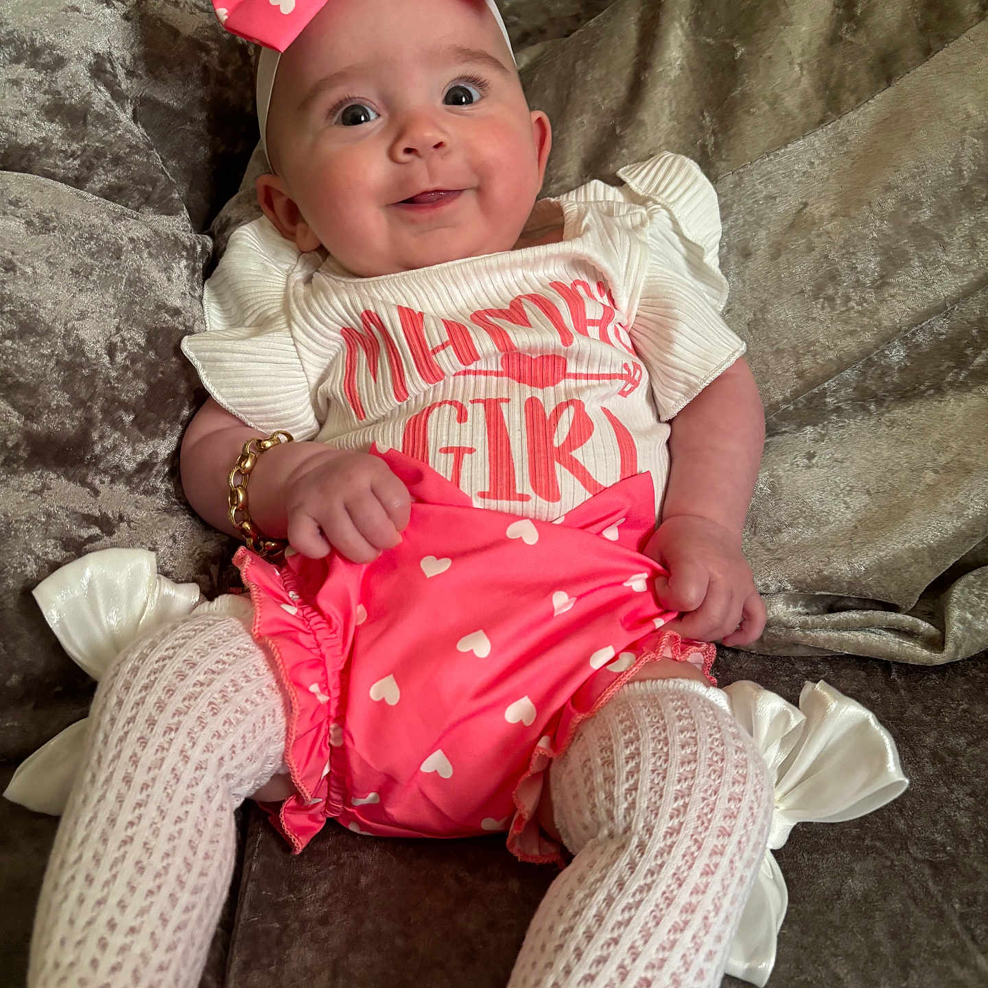 Rosalia-Raya joined the competition — help win amazing prizes! accessories, baby, bodypart, clothing, couch, cushion, dress, face, finger, furniture, hand, happy, hat, head, homedecor, person, photography, portrait, sitting, smile