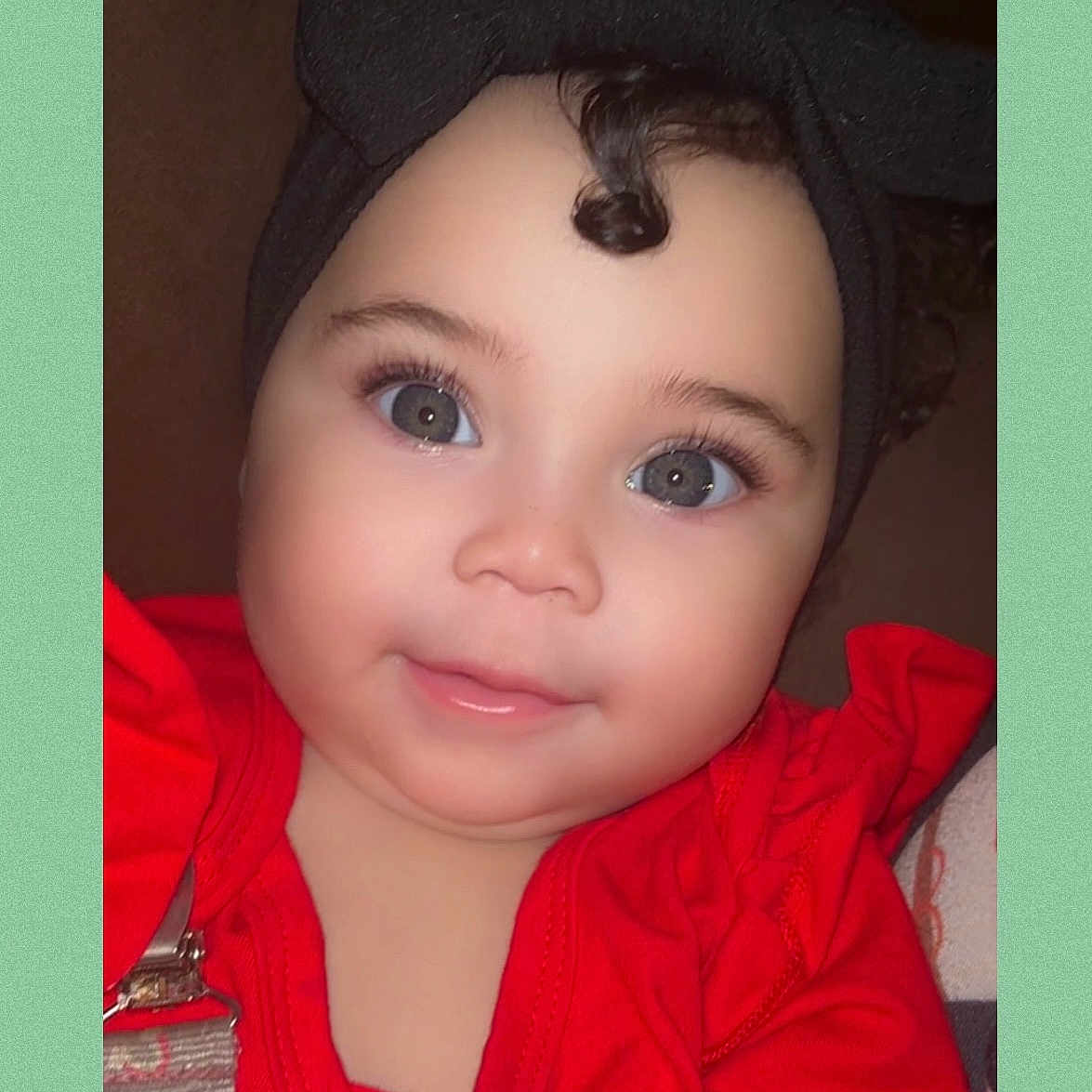 Stormi is registered to the contest to win money with this photo: baby, baseballcap, beanie, bonnet, cap, clothing, coat, face, happy, hat, head, hood, hoodie, jacket, knitwear, person, photography, portrait, smile, sweater