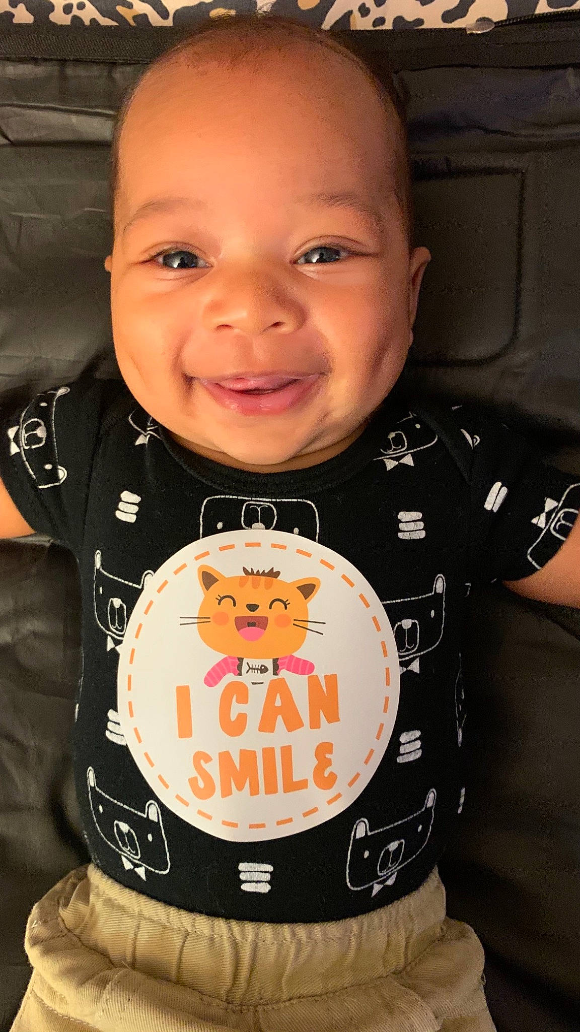 Niklaus is registered to the contest to win money with this photo: active_shirt, baby, baby_laughing, baby_toddler_clothing, buzz_cut, cheek, child, cool, eyebrow, forehead, happy, humour, iris, joy, laugh, lip, long_sleeved_t_shirt, mouth, person, sleeve