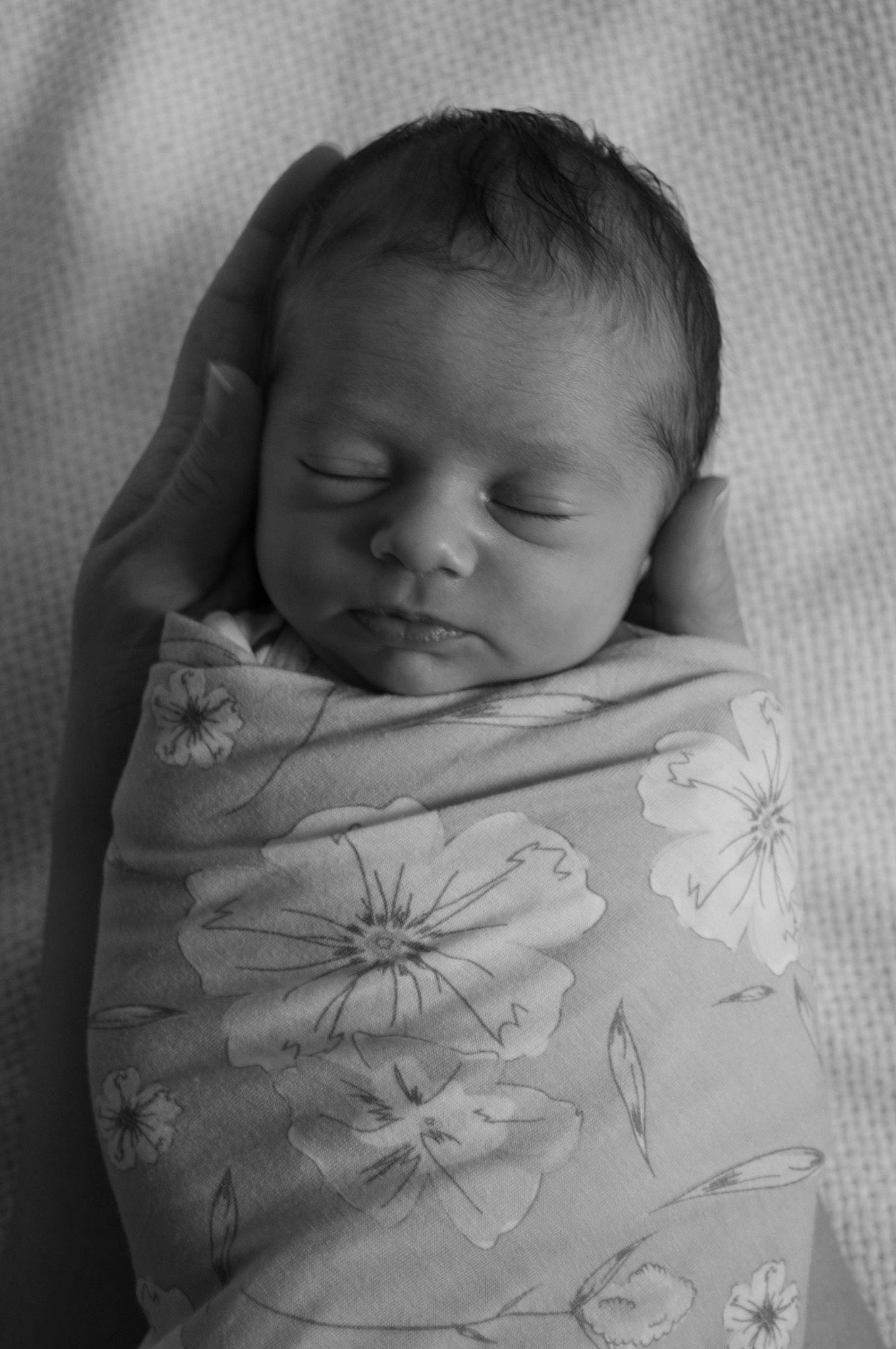 Ivoryella is registered to the contest to win money with this photo: arm, baby, cheek, comfort, eye, eyebrow, face, flash_photography, gesture, happy, human_body, iris, linens, lip, monochrome, nose, person, skin, sleeve, textile