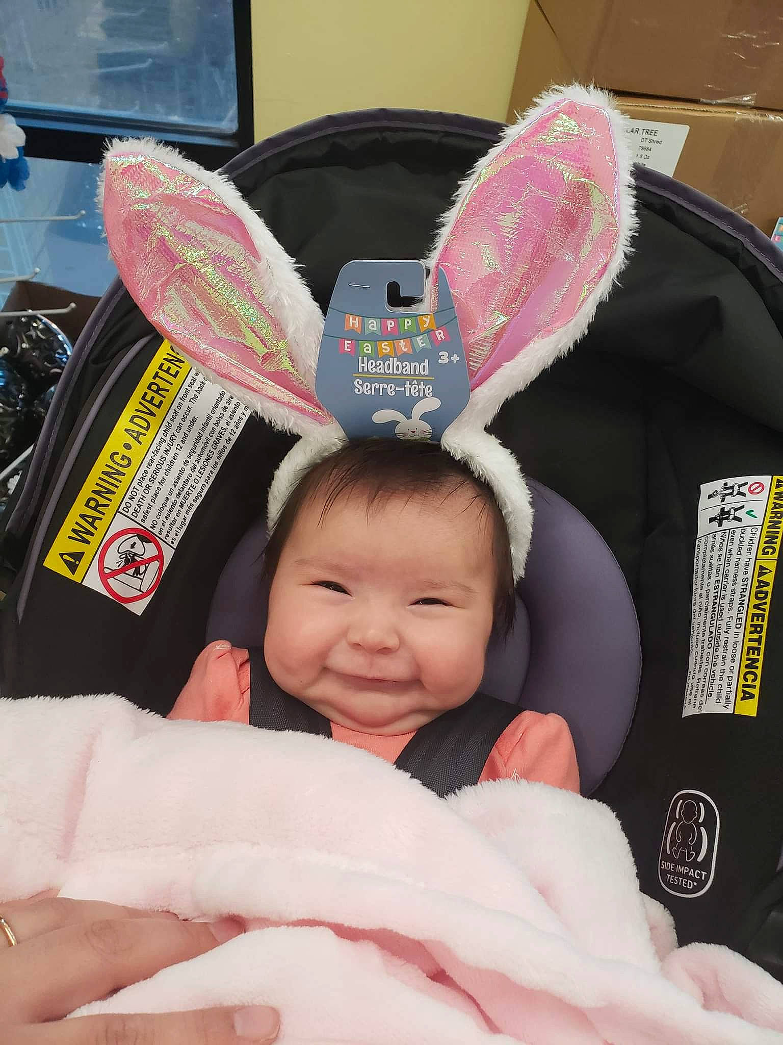 Kira joined the competition — help win amazing prizes! baby, baby_toddler_clothing, car_seat, child, comfort, costume_hat, eyewear, facial_expression, fashion_accessory, finger, fun, gesture, happy, person, pink, skin, smile, textile, thumb, toddler