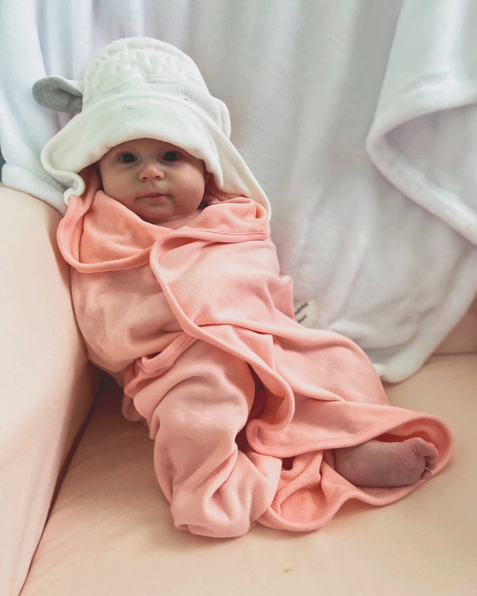 Collins is registered to the contest to win money with this photo: baby, baby_sleeping, child, headwear, linens, person, pink, sitting, smile, textile, toddler