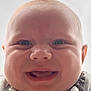 baby, smiling, close_up, face, chubby_cheeks, infant, cute, happy, panda_print, clothing, portrait, child, young, outdoor, head, skin, eyes, mouth, expression, casual