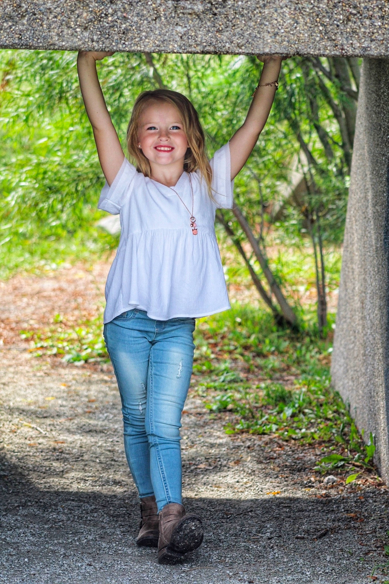 Autumn is registered to the contest to win money with this photo: beauty, blue, child, denim, eye, footwear, fun, grass, green, jeans, joy, leaf, outerwear, people, people_in_nature, person, photograph, photography, smile, standing