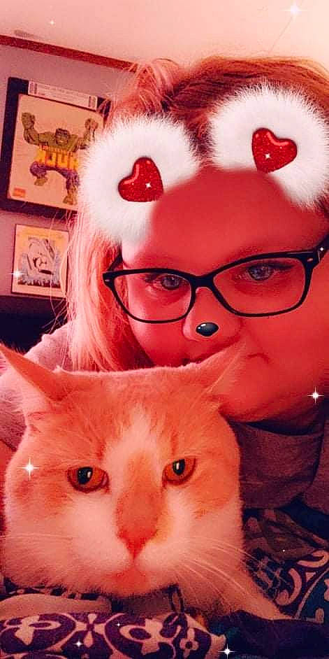 Oliver is registered to the contest to win money with this photo: beauty, carnivore, cat, eye, eyebrow, eyewear, facial_expression, fawn, felidae, glasses, hair, happy, head, nose, picture_frame, small_to_medium_sized_cats, snout, vertebrate, vision_care, whiskers