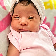 Kehlani is registered to the contest to win money with this photo: baby, infant, pink_clothing, white_towel, face, portrait, sleepy, soft_texture, blanket, close_up, newborn, cute, skin, headwear, child, resting, indoors, calm, young, person