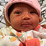 Kehlani is registered to the contest to win money with this photo: baby, newborn, infant, pink_hat, onesie, fruit_pattern, blanket, close_up, face, cute, child, sleepwear, soft, cozy, portrait, warm, young, person, hand, expression