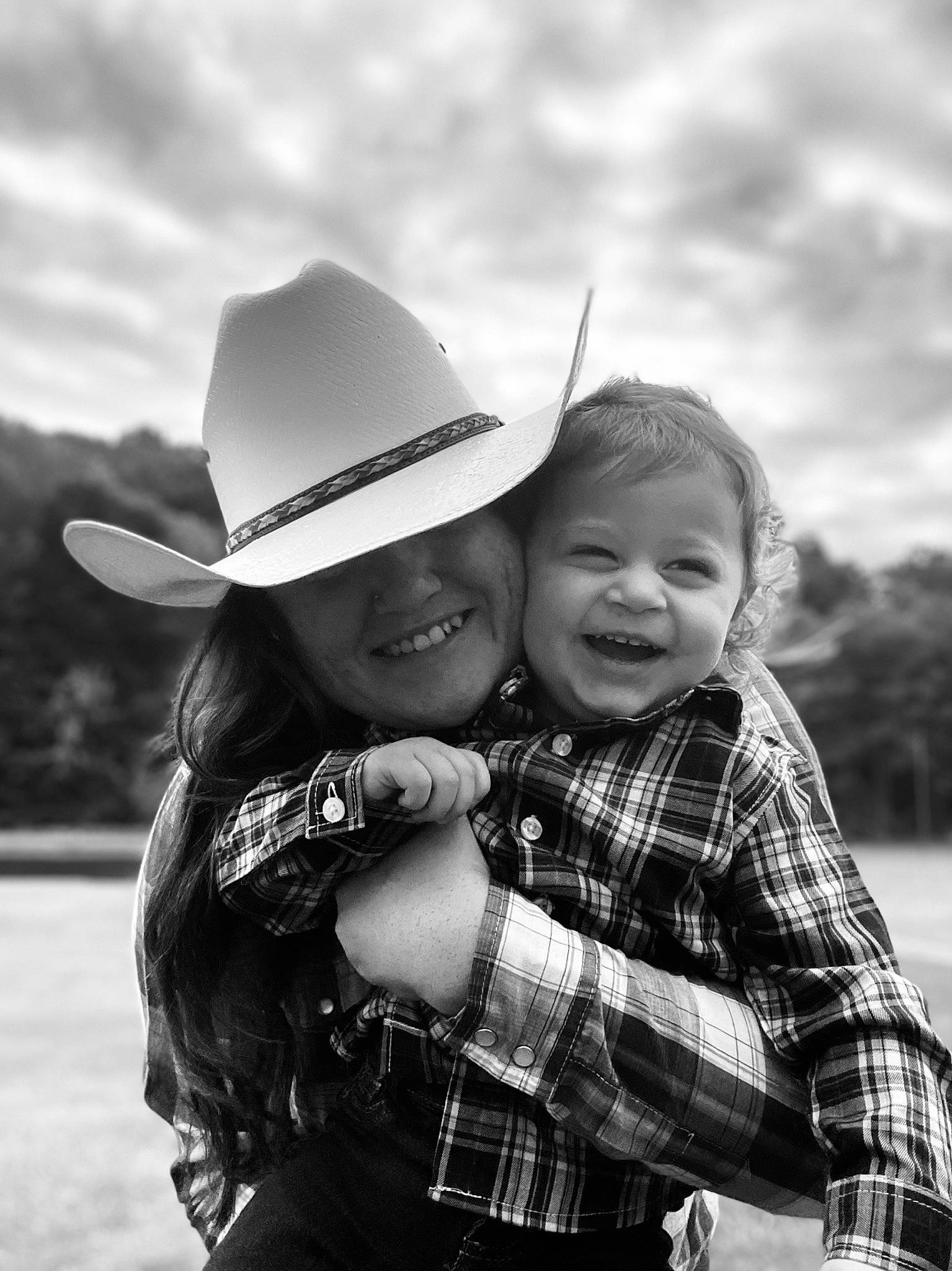 Nathaniel Aka Bry Bry is registered to the contest to win money with this photo: cloud, cool, flash_photography, grass, happy, hat, headgear, interaction, joy, people, people_in_nature, person, photograph, plaid, sky, smile, style, sun_hat, tartan, toddler