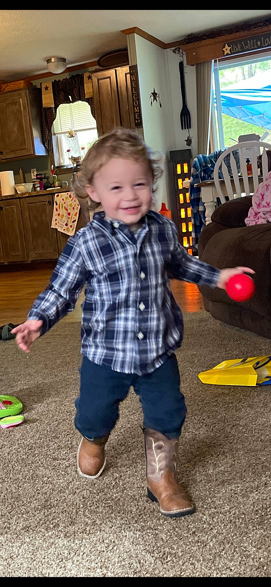 Nathaniel Aka Bry Bry is registered to the contest to win money with this photo: baby, baby_toddler_clothing, child, event, flooring, fun, happy, holiday, joy, lamp, pattern, person, picture_frame, plaid, play, room, sitting, smile, tartan, toddler