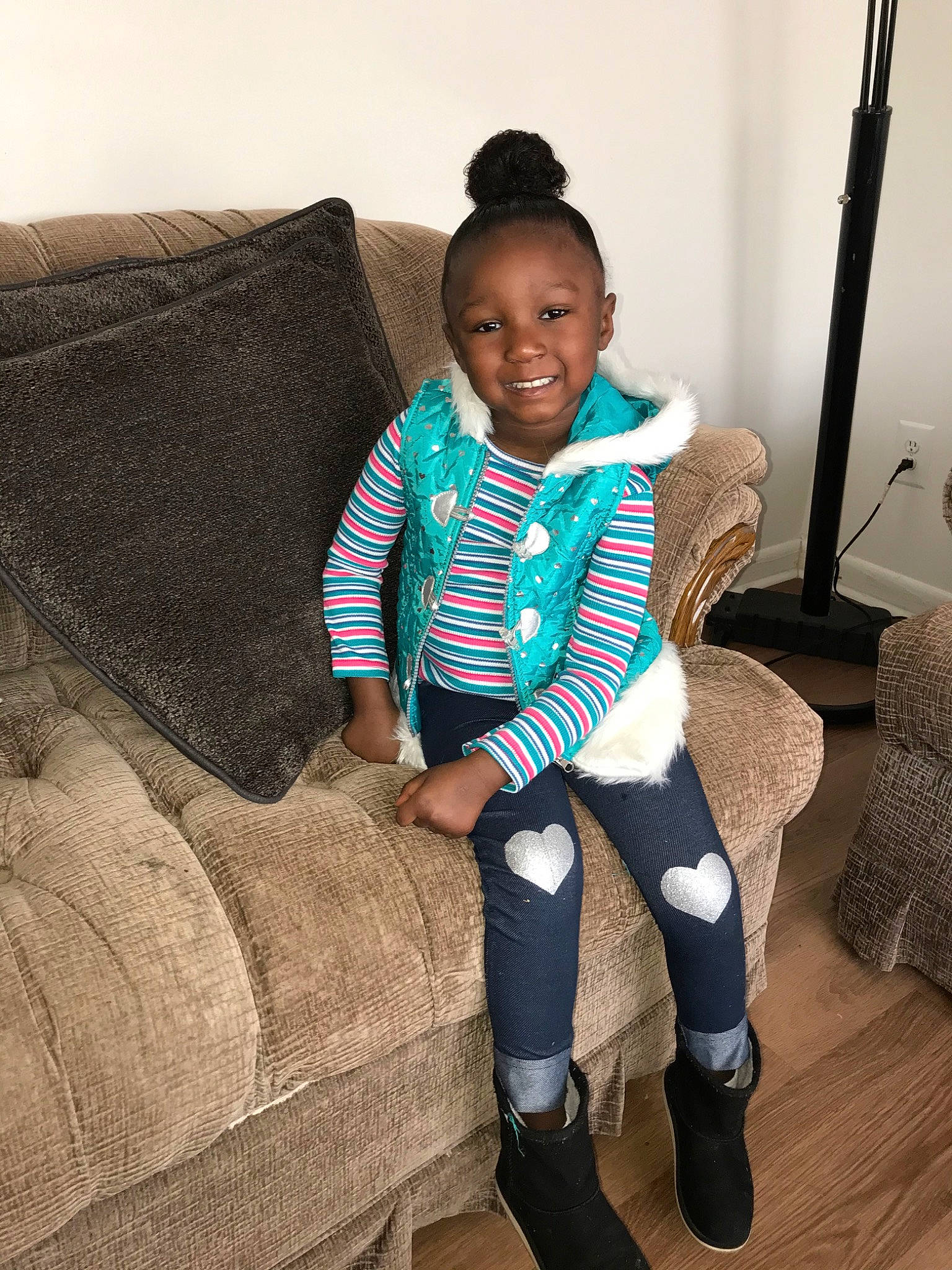 Marley is registered to the contest to win money with this photo: blue, chair, child, cool, couch, electronic_device, footwear, furniture, head, joint, joy, knee, leg, outerwear, person, shoe, sitting, skin, smile, sportswear