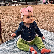 Olivia is registered to the contest to win money with this photo: baby, child, outdoor, grass, blanket, headband, bow, denim_jacket, pants, socks, panda, sunset, trees, houses, person, cute, sitting, smile, park, daylight