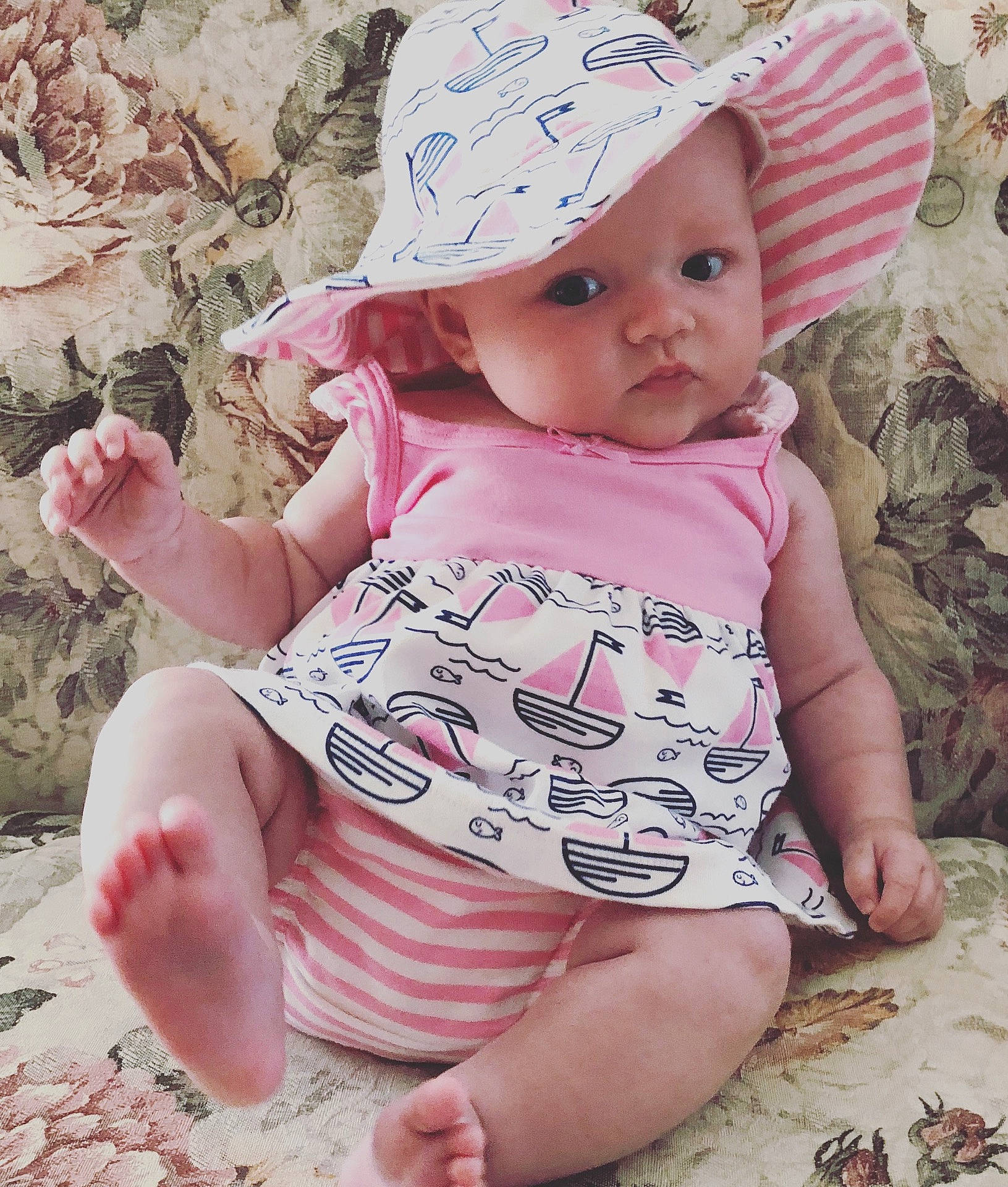 Carmen is registered to the contest to win money with this photo: cheek, child, girl, hair_accessory, headgear, headwear, infant, pattern, person, pink, product, skin, sun_hat, textile, toddler