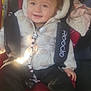 éva participe au concours pour gagner de l'argent avec cette photo : toddler, child, car_seat, jacket, panda, pacifier_clip, red_socks, smiling, happy, indoors, seatbelt, safety, clothing, baby, cute, infant, person, vehicle, sunlight, warm