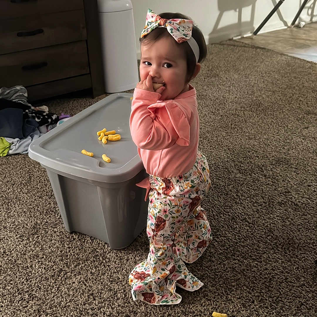 Nevaeh is registered to the contest to win money with this photo: baby, bathing, bodypart, box, cabinet, cap, clothing, face, finger, furniture, hand, happy, hardwood, hat, head, person, photography, portrait, smile, wood