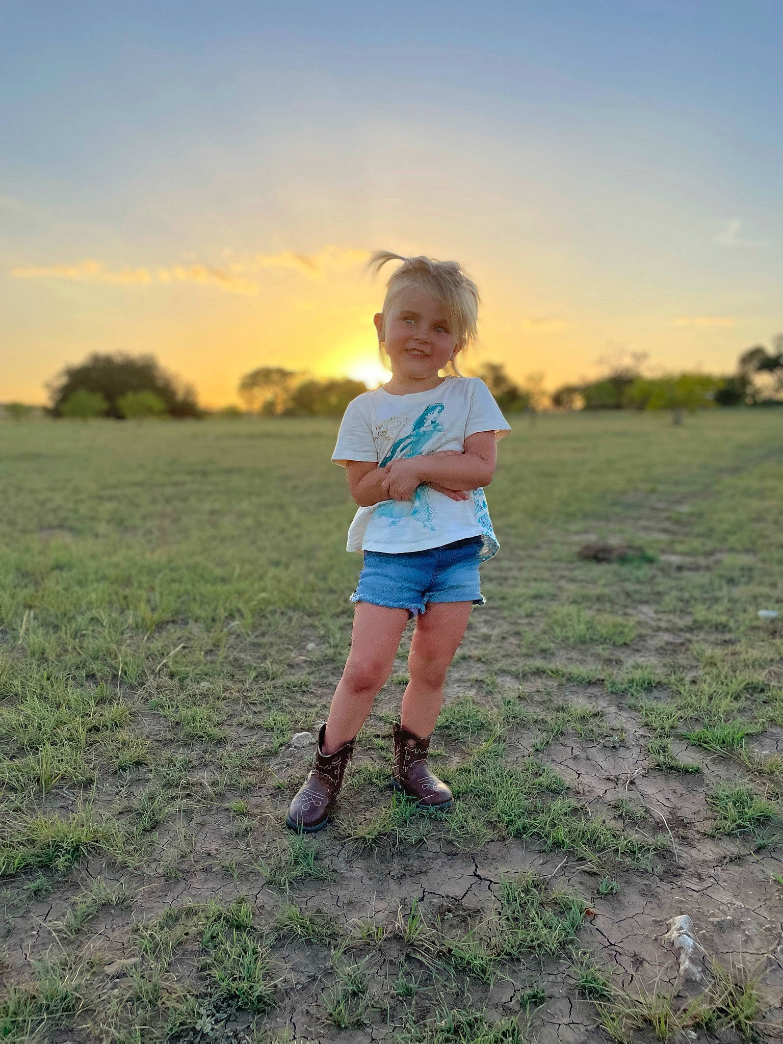 Kaydence is registered to the contest to win money with this photo: flash_photography, fun, grass, grass_family, grassland, happy, horizon, joy, landscape, leisure, meadow, people_in_nature, person, plain, plant, prairie, shorts, sky, standing, sunlight
